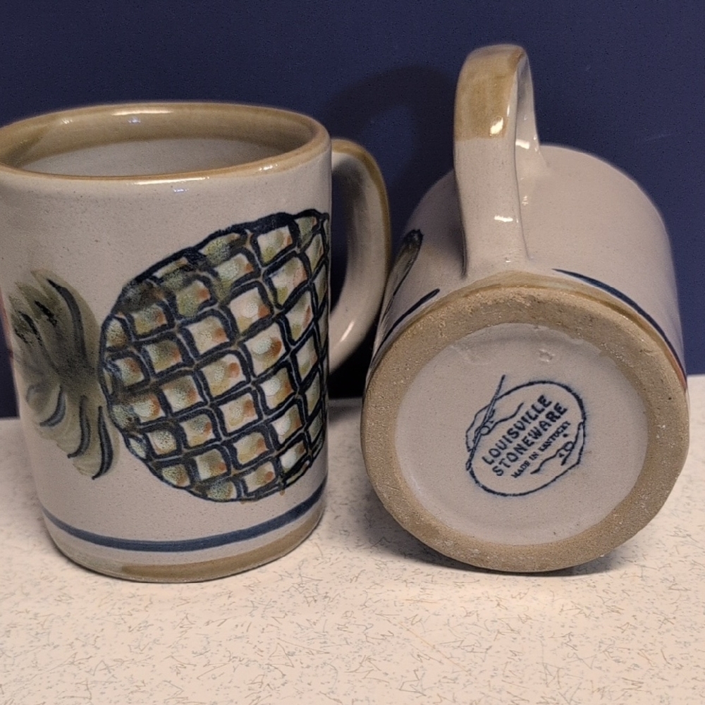 Hand-painted stoneware mug with a pineapple motif by Louisville Stoneware.